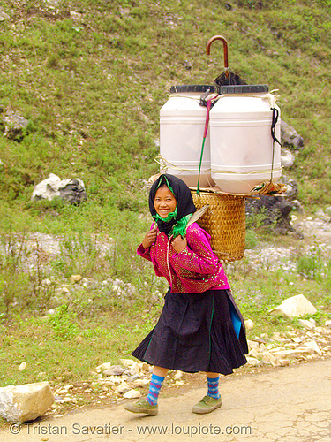 tribe girl with backpack - vietnam, asian woman, backpack, colorful, plastic cans, road, umbrella
