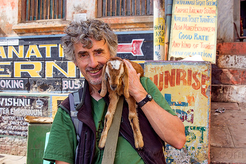 tristan savatier - selfie with kid on shoulder - baby goat, baby animal, baby goat, goat kid, man, self-portrait, selfie, signs, varanasi