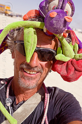 tristan savatier with burning man hat - self-portrait, attire, bunjees, burning man outfit, dragon, hat, headdress, rose, self-portrait, selfie, stuffed animal, sunglasses