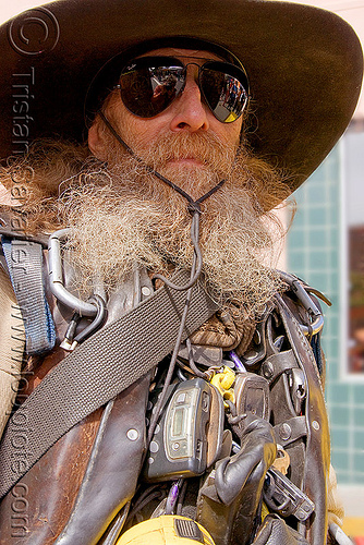 truck driver geared-up, beard, carabiners, dago, dark sunglasses, haight street fair, leather jacket, leather vest, leatherman, man, rayban sunglasses, tools, truck driver, trucker, wide rim hat