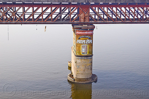 truss bridge pillar on ganges river (india), advertising, bridge pillar, ganga, ganges river, india, metal bridge, painted ad, truss bridge