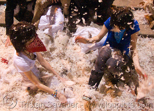 two girls in the feathers - the great san francisco pillow fight 2009 - olivia, bandana, down feathers, girls, night, olivia, pillows, women, world pillow fight day