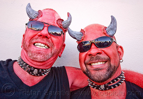 two men in red devils makeup with horns - folsom street fair (san francisco), costume, devil horns, face painting, facepaint, fake horns, make-up, prosthetic horns, red devils