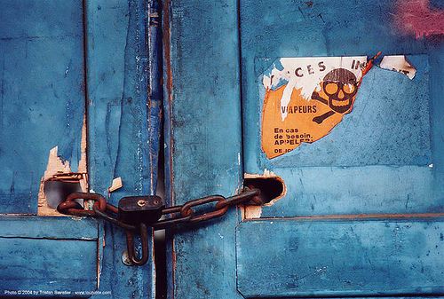 vapeurs dangereuses - grands moulins de paris, blue, chain, chained door, closed, crossbones, danger, industrial mill, lock, no access, no trespassing, padlock, skull and bones