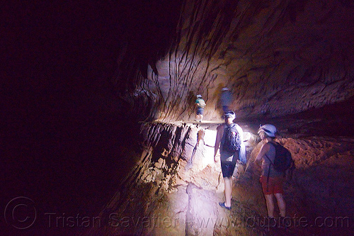 walking on a narrow ledge along clearwater river - caving in mulu (borneo), borneo, cavers, caving, clearwater cave system, clearwater connection, gunung mulu national park, malaysia, natural cave, river cave, roland, spelunkers, spelunking, underground river