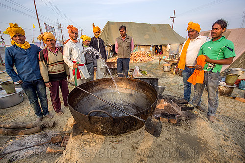 washing a large cooking pot in an ashram (india), ashram, big, cooking pot, group, hindu pilgrimage, hinduism, huge, kumbh mela, large, men, washing, water hose