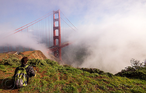 watching the golden gate bridge in the fog (san francisco), fog, golden gate bridge, grass, hill, sitting, suspension bridge, view, watching, woman, yassmine