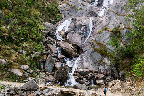 waterfall in the kali gandaki valley (nepal), annapurnas, cascade, cliff, dirt road, falls, kali gandaki valley, motorcycle, mountain road, rock, unpaved, waterfall