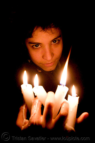 wax play - woman holding dripping candles, candles, cataphile, cave, clandestines, eyes, fetish, fire, illegal, low key, new year's eve, underground quarry, wax play, woman