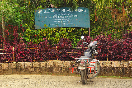 welcome to mawlynnong sign (india), east khasi hills, india, mawlynnong, meghalaya, motorcycle touring, parked, parking, royal enfield bullet, sign, thunderbird, welcome