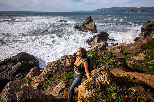 woman hiking near the ocean - rugged california coast, coast, hiking, ocean, rocks, rocky, rugged, sea, seashore, white water, woman, yassmine