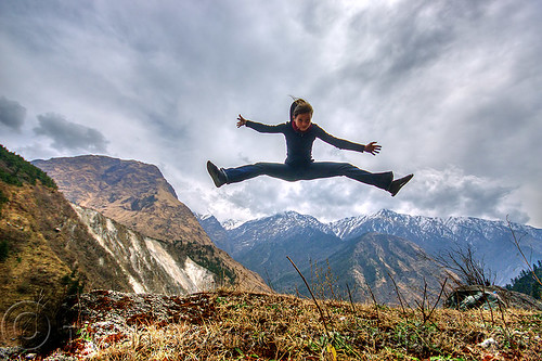 woman jumping over the himalaya mountains (nepal), annapurnas, anne-laure, clouds, cloudy, jump, jumpshot, kali gandaki valley, mountains, spread eagle, woman