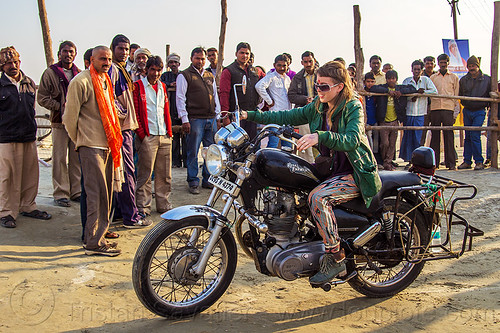 woman riding royal enfield bullet thunderbird motorcycle, 350cc, bun bun, crowd, hindu pilgrimage, hinduism, kumbh mela, men, motorcycle touring, motorcyclist, rider, riding, royal enfield bullet, spectators, thunderbird, watching, woman