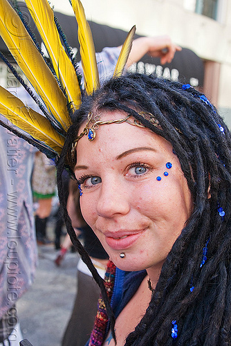 woman with blue bindis and yellow feather headdress, bindis, feather headdress, woman