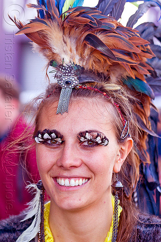 woman with feather costume and feather eyelashes, feather earrings, feather eyelashes, feather headdress, feathers, woman