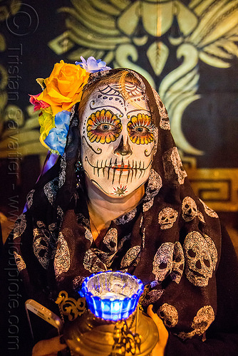 woman with sugar skull makeup - kara - dia de los muertos, black veil, blue, candle, day of the dead, dia de los muertos, face painting, facepaint, flower headdress, flowers, halloween, mural, night, orange rose flower, skulls pattern, sugar skull makeup, woman