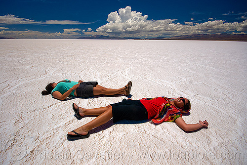 women laying on salt flat - salinassalinas grandes - salar (argentina), argentina, blue sky, camille, charlotte, halite, horizon, jujuy, laying down, noroeste argentino, rock salt, salar, salinas grandes, salt bed, salt flats, salt lake, white, women