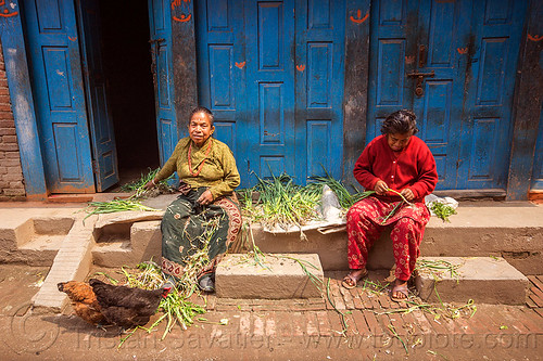 women preparing food in front of their house (nepal), bhaktapur, blue door, chickens, doors, sitting, women