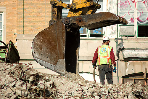 worker near excavator bucket - building demolition, abandoned building, abandoned hospital, at work, bucket attachment, building demolition, construction worker, excavator bucket, excavators, man, presidio hospital, presidio landmark apartments, rubble, working