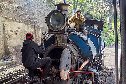 workers inspecting the boiler of a steam locomotive - darjeeling (india), 791, boiler, darjeeling himalayan railway, darjeeling toy train, fixing, men, narrow gauge, railroad, repairing, steam engine, steam locomotive, steam train engine, train depot, train yard, workers