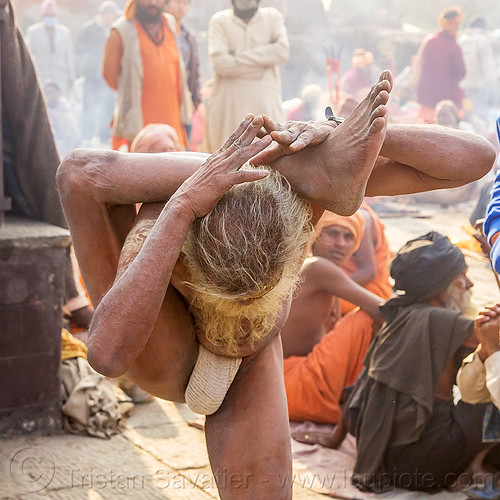 yogi sadhu in yoga position standing with leg behind the head (nepal), baba, beard, contortionist, hindu, hinduism, kathmandu, maha shivaratri, man, pashupatinath, sadhu, stretching, yoga, yogi