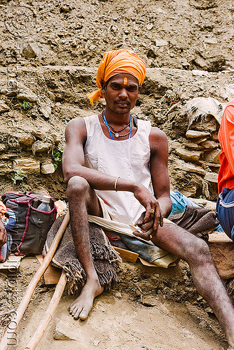 young crippled hindu pilgrim resting on trail - amarnath yatra (pilgrimage) - kashmir, amarnath yatra, crippled, headdress, hiking cane, hindu man, hindu pilgrimage, hinduism, kashmir, mountain trail, mountains, pilgrim, resting, trekking, turban, walking stick