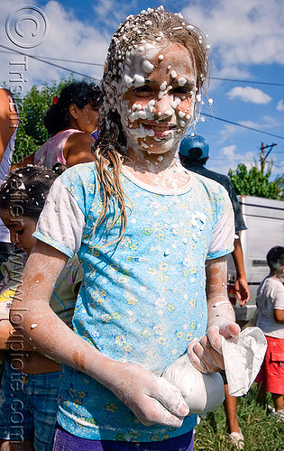 young girl covered with party foam - carnaval - carnival in jujuy capital (argentina), andean carnival, argentina, carnaval de la quebrada, girl, jujuy capital, noroeste argentino, party foam, san salvador de jujuy, talk powder, woman