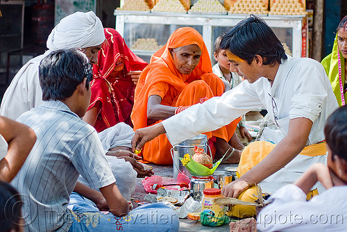 young guru (hindu holy man) performing ceremony - orchha (india), bhagwa, ceremony, guru, hindu holy man, hinduism, men, orchha, ritual, saffron color, women