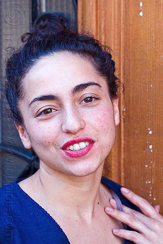 young italian woman portrait - face, brunette, curly hair, dilve, door window, house door, italian woman, long hair, red lipstick