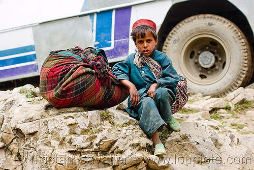 young kashmiri boy - child labor - amarnath yatra (pilgrimage) - kashmir, amarnath yatra, bag, child labor, child labour, hindu pilgrimage, kashmir, kid, load bearer, mountain trail, mountains, muslim, pilgrim, road, tire, wallah