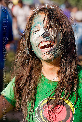 young woman covered with colored powder during carnival in jujuy capital (argentina) - naty jael