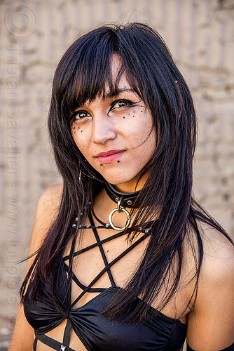 young woman with shiny black eyes, bindis, black eyes, eye makeup, eyeliner, fashion, lip piercing, peircing, shiny eyes, snake bites piercing, woman