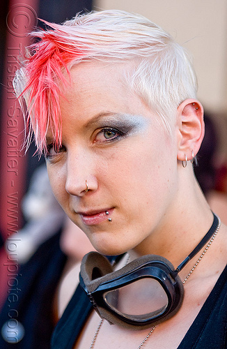 young woman with short blond and pink hair - kate (san francisco), blonde, ear piercing, goggles, kate, lip piercing, pink, woman