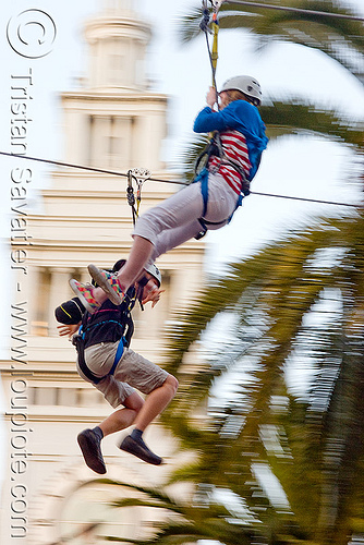 zip-line over san francisco, adventure, blue sky, cable line, cables, campanil, climbing helmet, clock tower, embarcadero tower, ferry building, hanging, mountaineering, moving fast, palm trees, speed, steel cable, trolley, tyrolienne, urban, zip line, zip wire