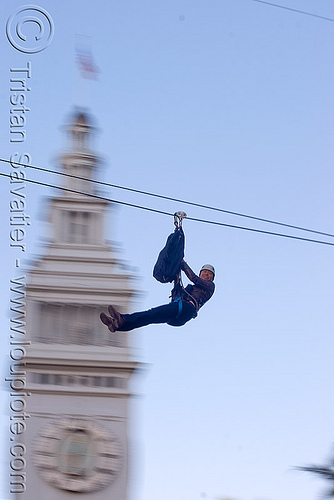 zip-line over san francisco, adventure, blue sky, cable line, cables, campanil, climbing helmet, clock tower, embarcadero tower, ferry building, hanging, mountaineering, moving fast, speed, steel cable, trolley, tyrolienne, urban, zip line, zip wire