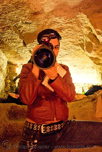 alyssa with video camera - catacombes de paris - catacombs of paris (off-limit area), camcorder, candles, cataphile, cave, clandestines, illegal, new year's eve, shooting, underground quarry, video camera, woman