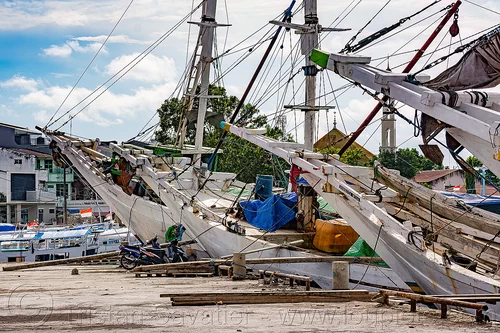 bows of traditional pinisi boats (bugis schooners) docked at the makassar harbor, boats, bugis schooners, dock, harbor, makassar, pinisi, ship bow, ships