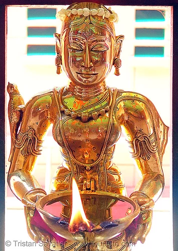 brass statue of a kho me goddess - deity (saigon) - vietnam, brass, burning, fire, goddess, golden color, khmer krom, kho-me, sculpture, statue, temple, woman