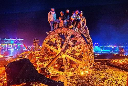 burning man - giant gears, burning man at night, embers, fire