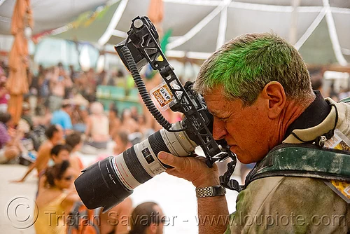 burning man - pararazzi at center camp cafe, canon, jim bottorff, man, paparazzi, photographer, shooting, zoom lens