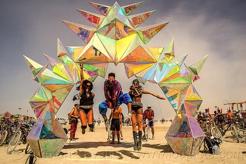 burning man - people jumping under the pulse portal, arch, art installation, iridescent, jumpshot, pulse portal, sculpture