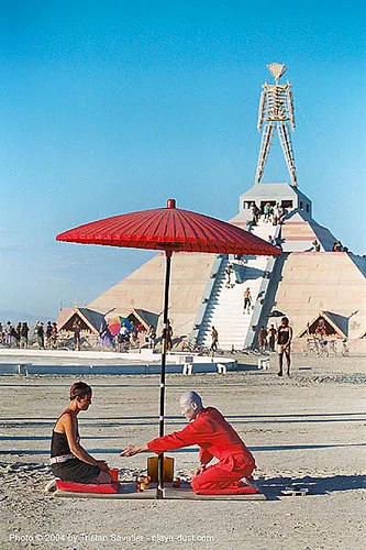 burning man - red tea ceremony by ken hamazaki, art installation, greentea, japan, japanese tea ceremony, ken hamazaki, pyramid, red tea ceremony, red umbrella, the man