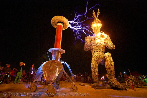 burning man - tesla coil electric arcs and crude awakening, art installation, burning man at night, electric arc, electric discharge, fire, high voltage, lightnings, plasma filaments, sculpture, static electricity, tesla coil