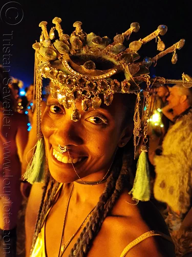 burning man - woman with headdress near man's burn, attire, burning man at night, burning man outfit, headdress, woman
