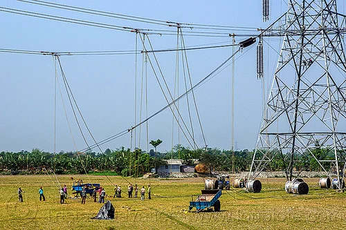 cable riggers installing power lines on transmission tower (india), cable riggers, cable wheels, cables, construction, electric line, electricity pylons, electricity transmission towers, high voltage, men, power line, power transmission lines, pulleys, pylon, rigging, ropes, wires, workers
