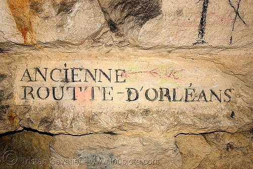 carved plate indicating road name - catacombes de paris - catacombs of paris (off-limit area), ancienne, cave, clandestines, d'orleans, d'orléans, illegal, new year's eve, plate, routte, sign, underground quarry