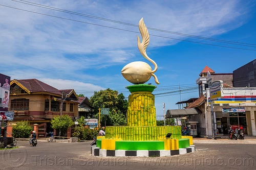 coconut sprouting monument on traffic circle, coconut, monument, road, roundabout, sprouting, traffic circle, village