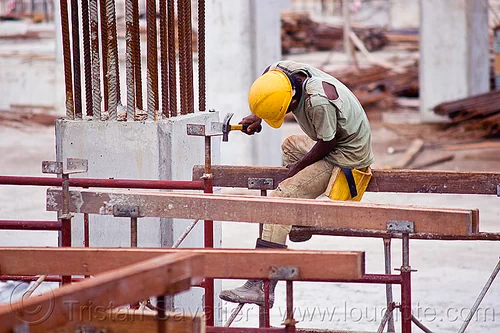 construction worker - shoring, borneo, building construction, construction site, construction workers, hammer, lumber, malaysia, man, miri, rebars, safety helmet, scaffolding, shoring, sitting, timber, working