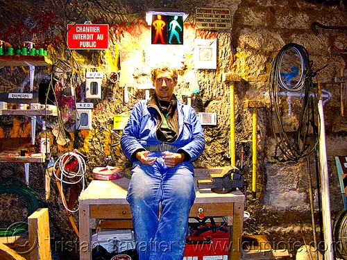 construction worker - tristan savatier, cave, construction worker, contractor, hammers, man, night, safety signs, self portrait, tools, workbench, workspace
