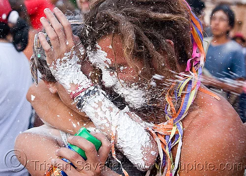 couple with party foam spray - carnaval de tilcara (argentina), andean carnival, argentina, carnaval de la quebrada, carnaval de tilcara, foam spray, man, noroeste argentino, party foam, quebrada de humahuaca, splashed, woman